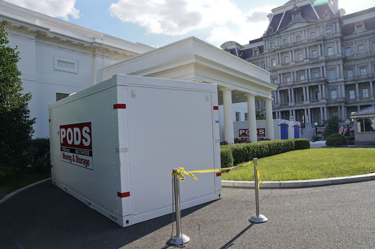 Moving and Storage containers are places on the driveway entrance to the West Wing of the White House in Washington, Saturday, Aug. 5, 2017. President Donald Trump and his staff temporarily moved out of the West Wing as renovations on the building got underway. Trump left Friday for what the White House has called an extended "working vacation" at his golf club in Bedminster, N.J., while his staff in Washington will clear out of the West Wing and move into the Eisenhower Executive Office Building next door. Work has already begun to replace the West Wing's 27-year-old heating, ventilation and air conditioning (HVAC) system. (AP Photo/Pablo Martinez Monsivais)
