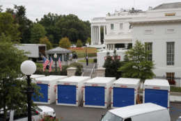 Storage containers line the driveway as the West Wing of the White House in Washington goes through renovations while President Donald Trump is spending time at his golf resort in New Jersey, Friday, Aug. 11, 2017. (AP Photo/J. Scott Applewhite)