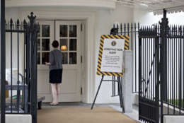 A sign alerts visitors at a West Wing entrance of the White House in Washington, Friday, Aug. 11, 2017, during renovations while President Donald Trump is spending time at his golf resort in New Jersey. (AP Photo/J. Scott Applewhite)