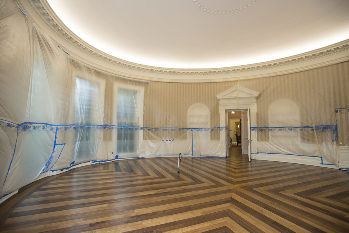 The hardwood floor of the Oval Office is resurfaced as the West Wing of the White House in Washington undergoes renovations while President Donald Trump is spending time at his golf resort in New Jersey, Friday, Aug. 11, 2017. (AP Photo/J. Scott Applewhite)