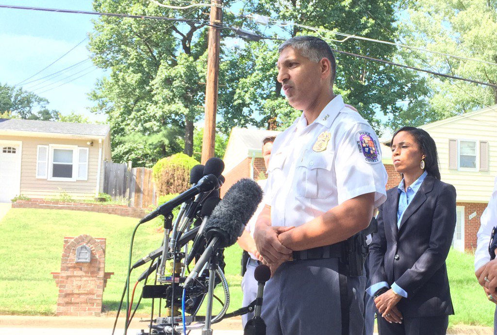 Prince George's County Police Deputy Chief Sammy Patel updates the media on the homicide investigation into the deaths of three young girls whose bodies were found inside a Clinton, Maryland, home. Prince George's County State's Attorney, Angela Alsobrooks stands behind Patel. (WTOP/Kristi King)