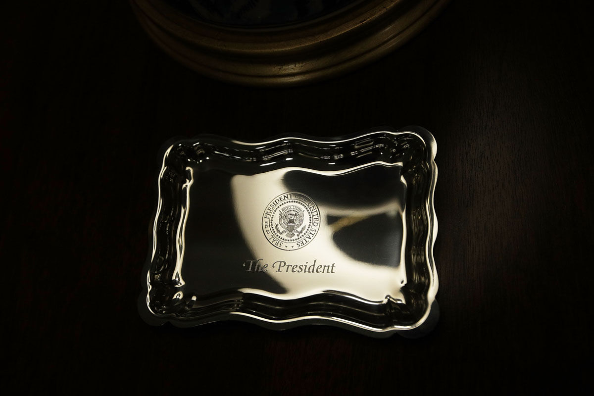 WASHINGTON, DC - AUGUST 22:  A tray engraved with the presidential seal is placed on a stand in the West Wing lobby of the White House August 22, 2017 in Washington, DC. The White House has undergone a major renovation with an upgrade of the HVAC system at the West Wing, the South Portico steps, the Navy mess kitchen, and the lower lobby.  (Photo by Alex Wong/Getty Images)