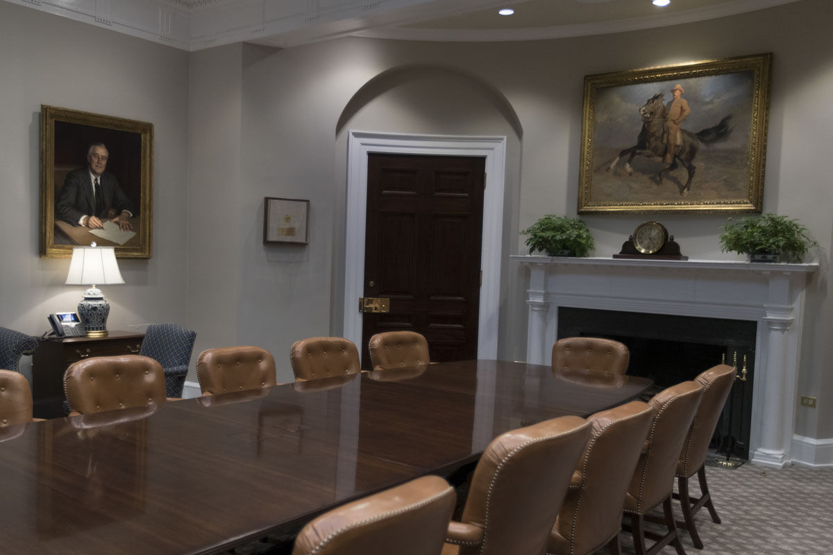 A portrait of Theodore Roosevelt "The Rough Rider" by TadÃ© (Thadeus) Styka, right, and a portrait of Franklin Delano Roosevelt by Alfred Jonniaux, left, are seen in the newly renovated Roosevelt Room of the White House in Washington, Tuesday, Aug. 22, 2017, during a media tour. (AP Photo/Carolyn Kaster)
