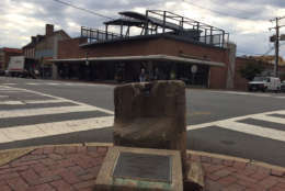 The old auction block -- concrete and not much taller than a fire hydrant -- is one of Fredericksburg's reminders of its history in the slave trade. The city council acted Tuesday to allow city officials to develop recommendations about what to do with the auction block. (WTOP/Dennis Foley)