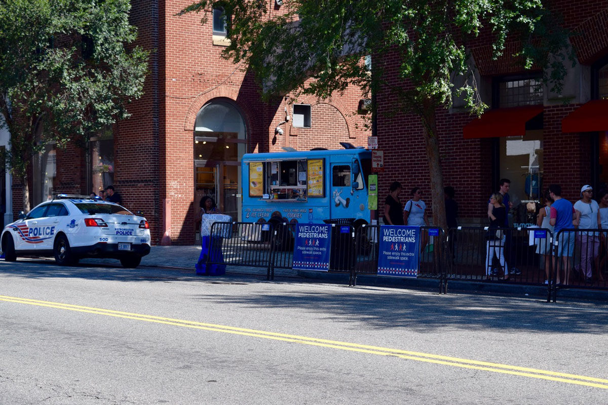 The food trucks are tucked away off the street. You'll also notice more wiggle-room for pedestrians in Georgetown on weekends. Temporary barriers claim part of M Street's curb lane to add pedestrian walkways. (Courtesy Bulldog Public Relations)