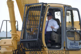 Gov. Larry Hogan got behind the controls of a large claw excavator to help rip down a large metal structure at the future home of the Purple Line Operations Center. (Courtesy Maryland governor's office)