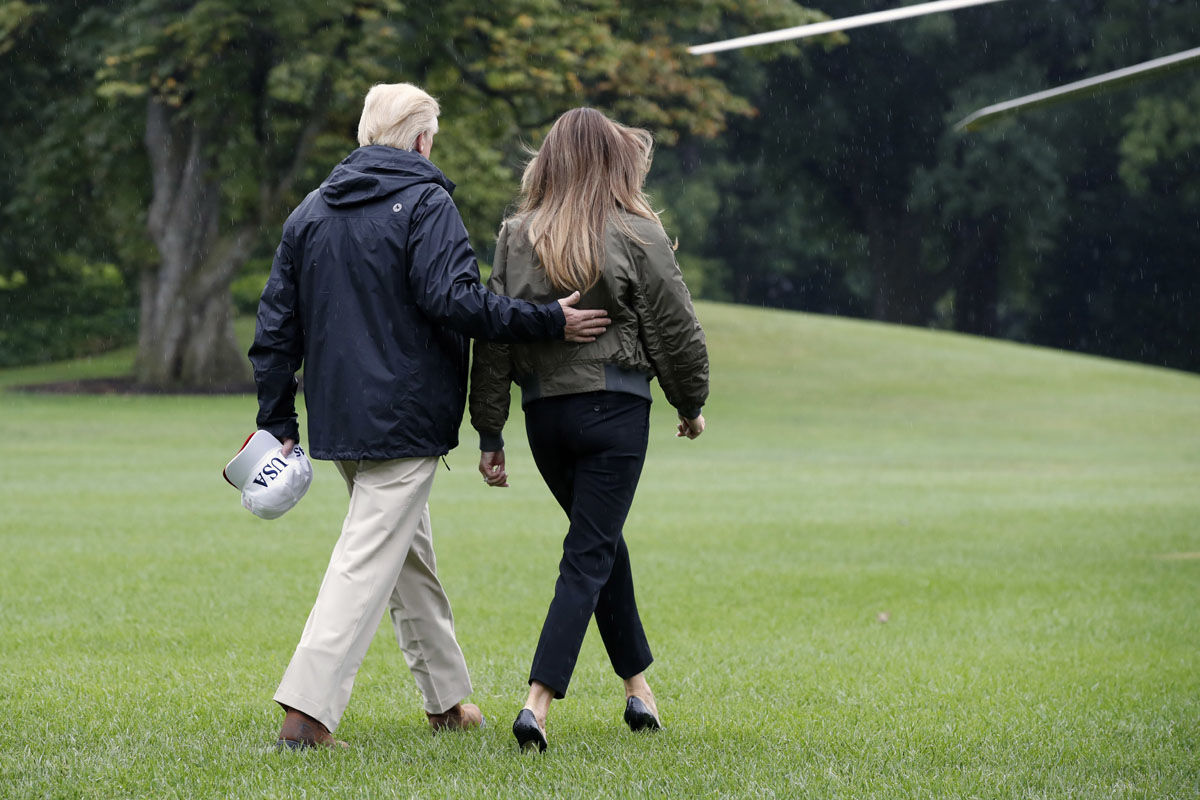 President Donald Trump walks with first lady Melania Trump to Marine One on the South Lawn of the White House in Washington, Tuesday, Aug. 29, 2017, for a short trip to Andrews Air Force Base, Md., then onto Texas to survey the response to Hurricane Harvey. The hurricane is the first major disaster of Trump's presidency.  (AP Photo/Jacquelyn Martin)