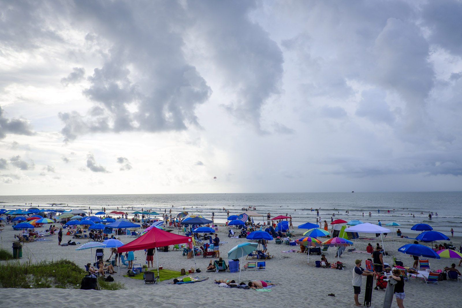 ISLE OF PALMS, SC - AUGUST 21:  Solar eclipse watchers on the beach hoping to view the total solar eclipse if the weather clears on August 21, 2017 in Isle of Palms, South Carolina. It's been 99 years since a total solar eclipse crossed the country from the Pacific to the Atlantic. Millions of people have flocked to areas of the U.S. that are in the "path of totality" in order to experience a total solar eclipse. During the event, the moon will pass in between the sun and the Earth, appearing to block the sun. Isle of Palms is one of last vantage points where totality will be visible. (Photo by Pete Marovich/Getty Images)