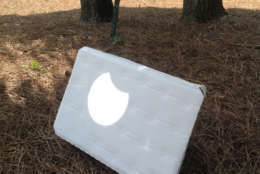 A view of the eclipse from a projected image of the sun from a telescope onto white cardboard in Brevard, North Carolina. (Courtesy Mike Stinneford)