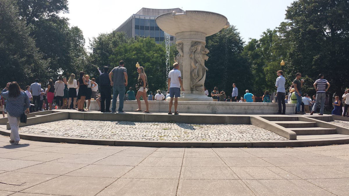 People in Dupont Circle gaze skyward ahead of the eclipse. (Courtesy Matt Ritter)