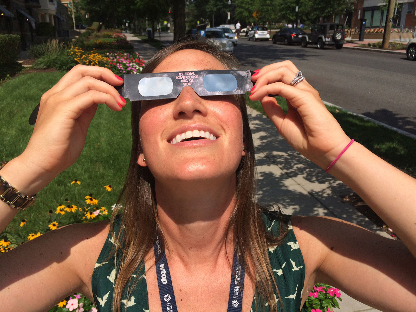 Sarah Beth Hensley, Senior Digital Editor at WTOP, stepped out of the glass enclosed nerve center to take a peek at the eclipse. (WTOP/Sarah Beth Hensley)
