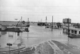 A typical scene in Galveston, Texas on Sunday, Sept. 10, 1961, was this inundated street, one of many closed by rising tides of hurricane Carla. (AP Photo/Ted Powers)