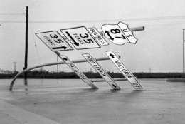 Fierce winds accompanying hurricane Carla bent this heavy steel pole holding road signs outside Port Lavaca, Texas on Sept. 12, 1961. The hurricane caused extensive damage in this coastal city. (AP Photo/Ted Powers)