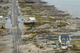 A beachfront home stands among the debris in Gilchrist, Texas on the coast of the Gulf of Mexico on Sunday, Sept. 14, 2008 after Hurricane Ike hit the area. Ike was the first major storm to directly hit a major U.S. metro area since Hurricane Katrina devastated New Orleans in 2005.  (AP Photo/Pool, Smiley N. Pool)