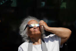 Martha Harris and her family were in from New York City and made a point of taking in the solar eclipse. (WTOP/Kate Ryan)