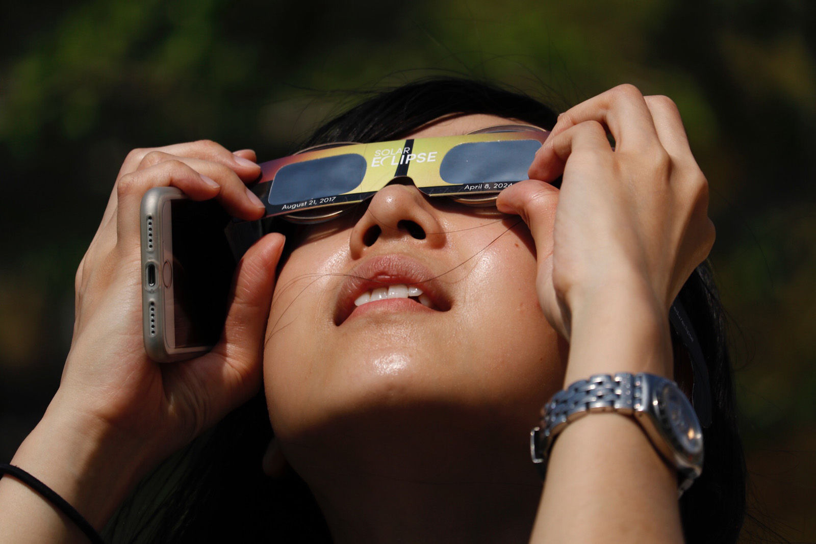 Stellar Chen, who has a name that was singularly appropriate for today's event, takes in the solar eclipse in D.C. (WTOP/Kate Ryan)