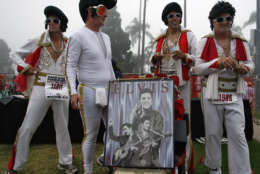 A group of runners dressed as Elvis Presley prepare before the start of the Rock 'n' Roll Marathon in San Diego, Sunday, June 4, 2006. Over 20,000 runners took part in the annual music themed race. (AP Photo/Denis Poroy)