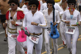 A group of runners dressed as Elvis Presley lead at the start of the Rock 'n' Roll Marathon in San Diego, Sunday, June 4, 2006. Over 20,000 runners took part in the annual music themed race. (AP Photo/Denis Poroy)