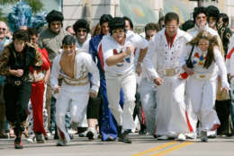 Elvis Presley impersonators take part in the first annual Running of the Elvises on the Nicollet Mall Friday, Aug. 17, 2007 in Minneapolis. The two-block race was part of a tribute to remember Presley, who died 30 years ago Thursday.  (AP Photo/Jim Mone)