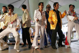 Filipino Elvis Presley impersonators dance during a contest in suburban Manila on Sunday Aug. 19, 2007. The event was held as a tribute to the 30th death anniversary of Elvis Presley. (AP Photo/Aaron Favila)