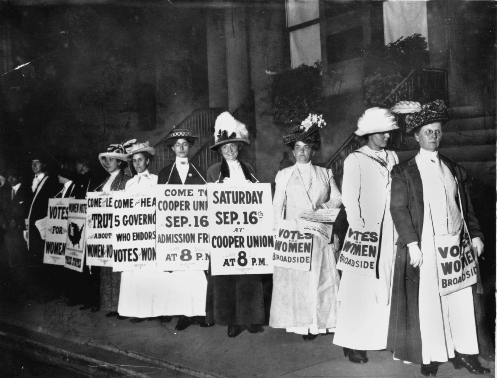 A line of women rally for women's suffrage and advertise a free rally discussing women's right to vote in Washington D.C. on Oct. 3, 1915.  (AP Photo)