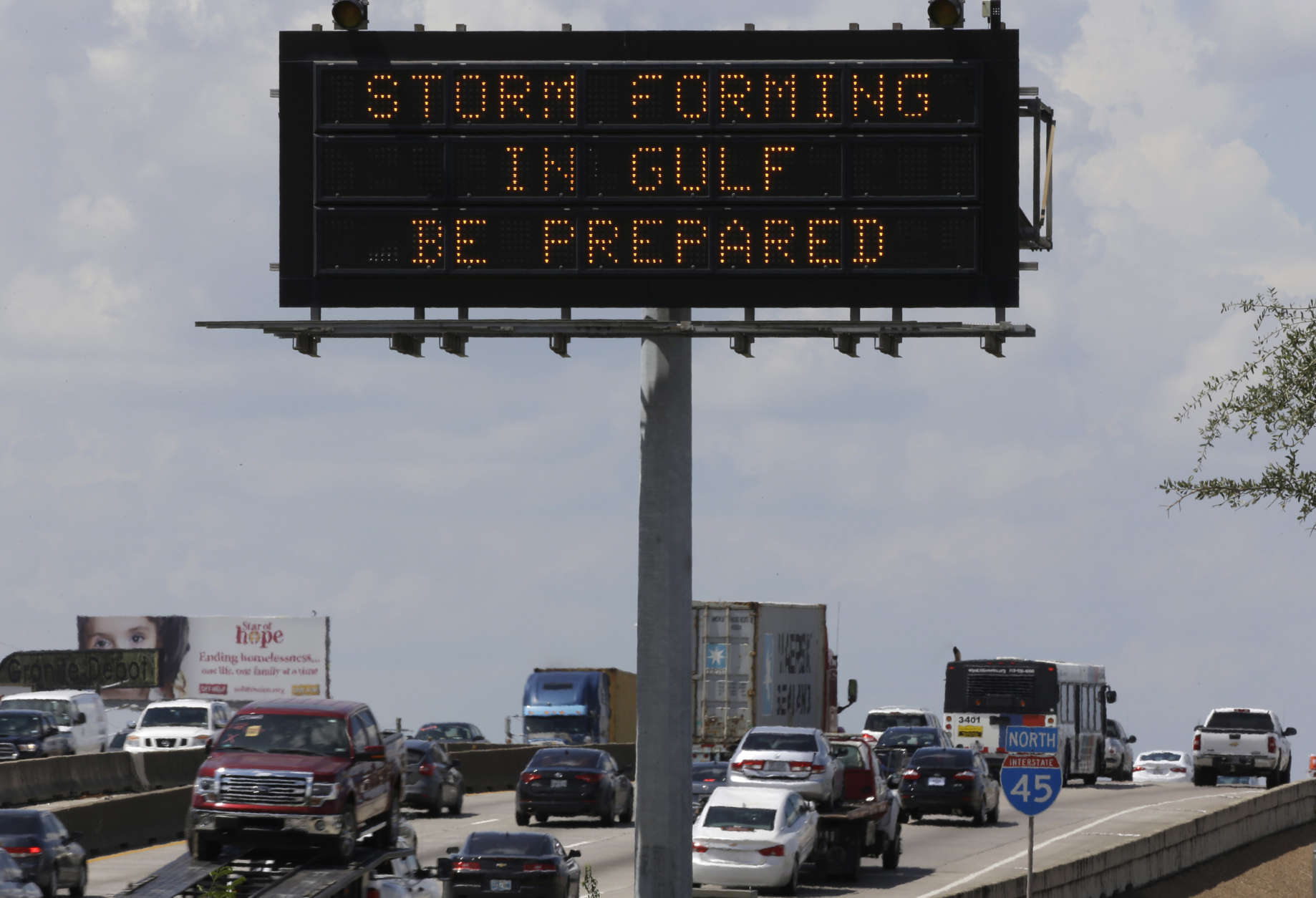Motorists in Houston pass a sign warning of Hurricane Harvey as the storm intensifies in the Gulf of Mexico, Thursday, Aug. 24, 2017. Harvey is forecast to be a major hurricane when it makes landfall along the middle Texas coastline Friday. (AP Photo/David J. Phillip)