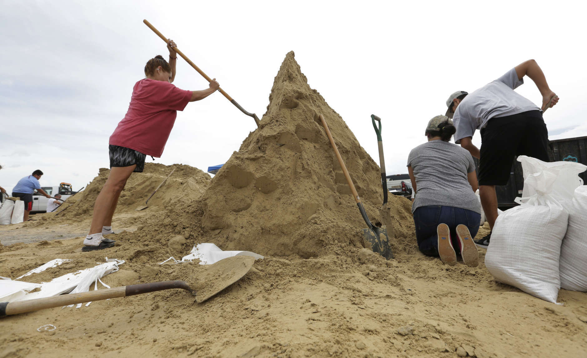 Residents fill sand bags as they prepare for Hurricane Harvey, Thursday, Aug. 24, 2017, in Corpus Christi, Texas.  Two counties have ordered mandatory evacuations as Hurricane Harvey gathers strength as it drifts toward the Texas Gulf Coast.   (AP Photo/Eric Gay)