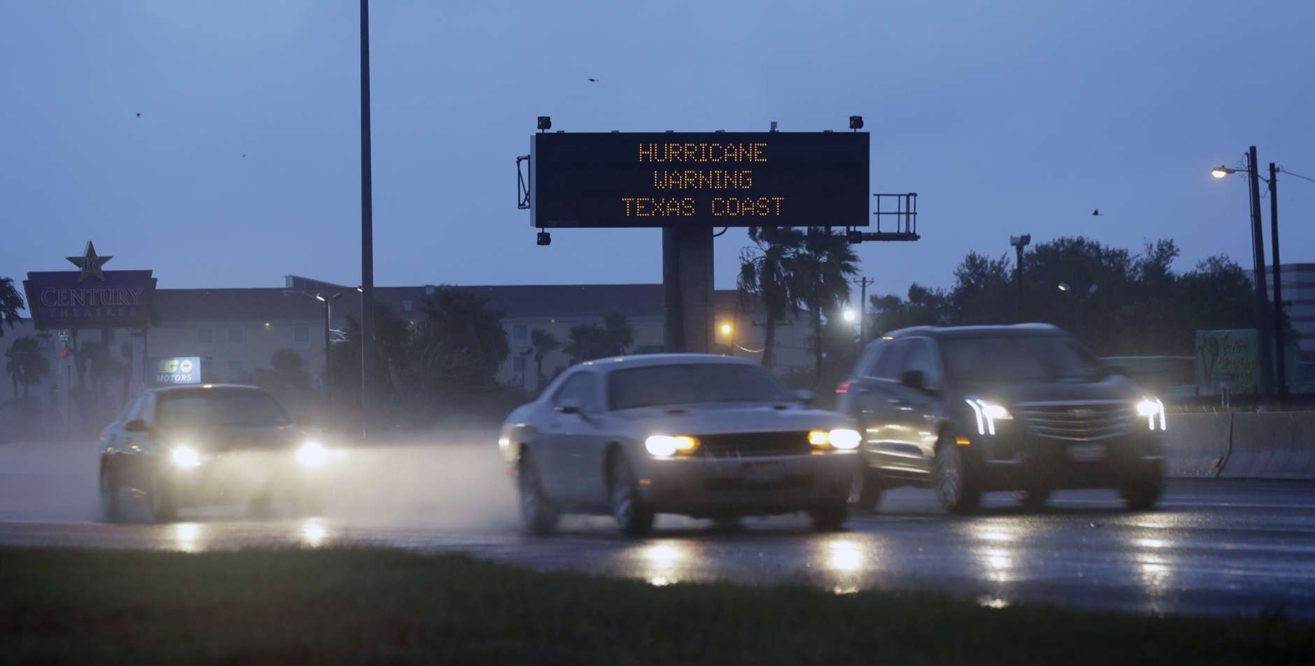 Motorists pass a warning sign as Hurricane Harvey approaches the Gulf Coast area Friday, Aug. 25, 2017, in Corpus Christi, Texas.  The slow-moving hurricane could be the fiercest such storm to hit the United States in almost a dozen years. Forecasters labeled Harvey a "life-threatening storm" that posed a "grave risk" as millions of people braced for a prolonged battering. (AP Photo/Eric Gay)