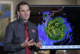 Michael Brennan, branch chief at the National Hurricane Center, gives an update on Hurricane Harvey as it moves toward the Texas coast, Friday, Aug. 25, 2017, in Miami.  The National Hurricane Center warns that conditions are deteriorating as Hurricane Harvey strengthens and slowly moves toward the Texas coast.  (AP Photo/Lynne Sladky)