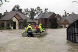 Volunteer rescue boats enter a flooded subdivision looking to evacuate residents as floodwaters from Tropical Storm Harvey rise Monday, Aug. 28, 2017, in Spring, Texas. (AP Photo/David J. Phillip)