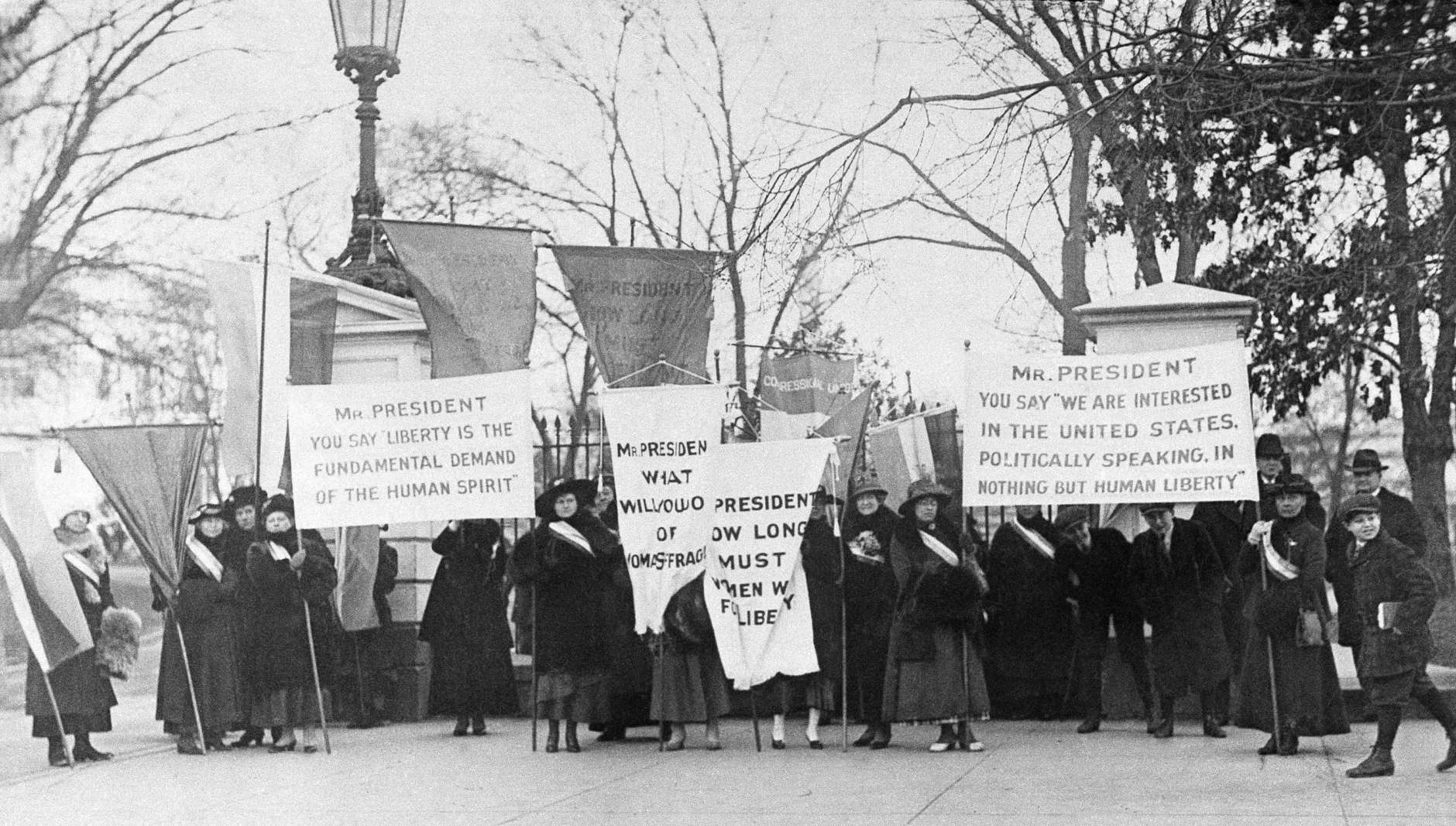 Women pickets at White House gate in Washington sometime in 1918. (AP Photo)