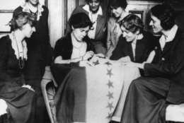 Celebrating ratification of the women's suffrage amendment, Alice Paul, seated second from left, sews the 36th star on a banner, in August of 1920.  The banner flew in front of headquarters of the Women's Party in Washington of which Miss Paul was national chairperson.  The 36th star represented Tennessee, whose ratification completed the number of states needed to put the amendment in the Constitution.  (AP Photo)