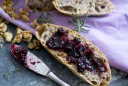 This Feb. 3, 2013 photo shows no knead walnut rosemary bread coated in a blueberry jam spread in Concord, N.H. (AP Photo/Matthew Mead)