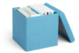 This photo provided by Poppin shows a storage unit called the Box Seat, that sells for the college contingent tired of the milk-crate look. It's covered with fabric in light and dark gray, navy, orange, red and pool blue, and is sturdy enough to withstand 275 pounds.  (Poppin via AP)