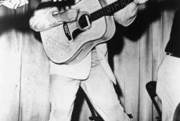 This is a 1956 photo of Elvis Presley performing.  This photo was used for his first RCA Victor album cover. (AP Photo)
