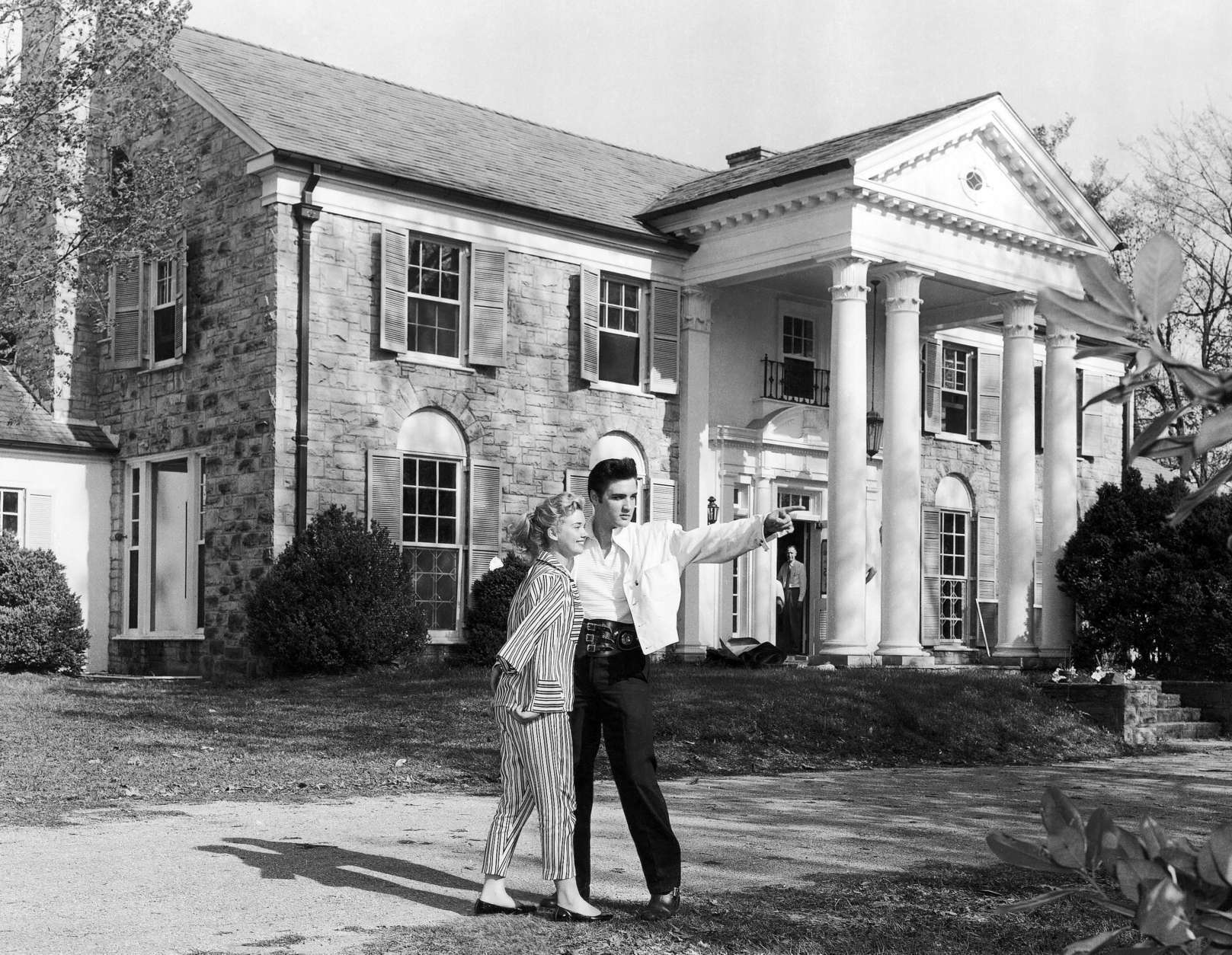 Elvis Presley with his girlfriend Yvonne Lime at his home Graceland in Memphis, Tennessee around 1957. (AP Photo)