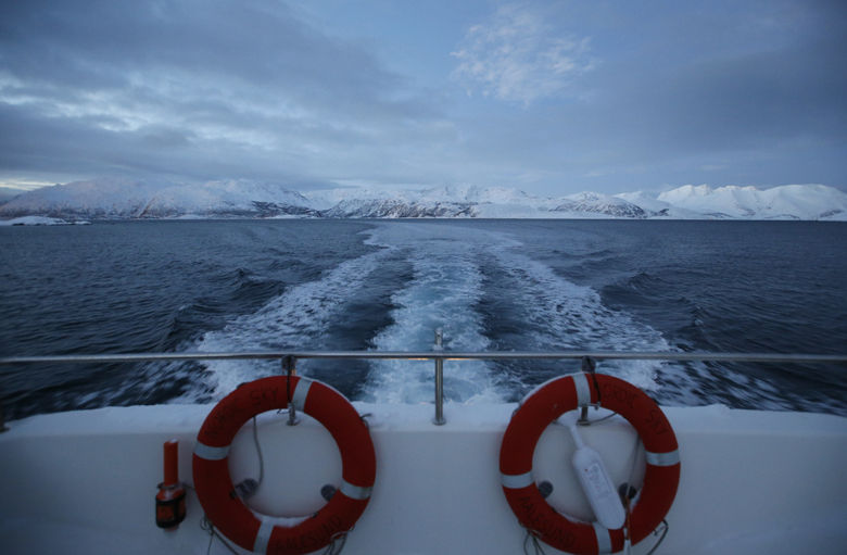 Two buoyancy floats on the stern of the ferry to the island of Seiland, showing the fjord behind in northern Norway, Tuesday, Feb. 2, 2016. Seiland is a remote part of northern Norway above 70 degrees north, with daylight in early February lasting barley 4 hours, and the ferry is used by school children to go to the mainland for their school education.(AP Photo/Alastair Grant)