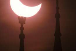 A partial eclipse of the sun was visible above the minaret of Dresden's Tabacco Mosque Saturday, Oct. 12, 1996. It was the best solar eclipse visible since 1961, that lasted about 2 and a half hours and covered the sun more than 50 percent. (AP Photo/Matthias Rietschel)