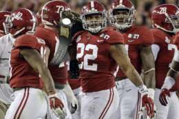 Alabama's Ryan Anderson gets a belt after recovering a fumble during the first half of the NCAA college football playoff championship game against Clemson Monday, Jan. 9, 2017, in Tampa, Fla. (AP Photo/David J. Phillip)