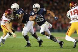 PASADENA, CA - JANUARY 02:  Running back Saquon Barkley #26 of the Penn State Nittany Lions runs with the ball against the USC Trojans during the 2017 Rose Bowl Game presented by Northwestern Mutual at the Rose Bowl on January 2, 2017 in Pasadena, California.  (Photo by Sean M. Haffey/Getty Images)