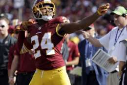 FILE - In this Oct. 2, 2016, file photo, Washington Redskins cornerback Josh Norman (24) celebrates his interception with a "bow and arrow," gesture during the second half of an NFL football game against the Cleveland Browns in Landover, Md. Don't twerk. Don't pretend to shoot a bow-and-arrow. Don't even think about playing basketball with a football. And, never take your helmet off. "This may seem crazy, but you can always just hand the ball to an official," Dean Blandino, the NFL's senior vice president for officiating, said in the video sent to news media and teams. (AP Photo/Chuck Burton, File)
