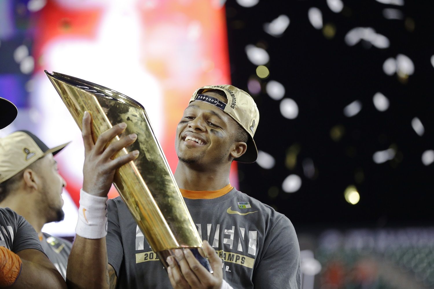 Clemson's Deshaun Watson holds up the championship trophy after the NCAA college football playoff championship game against Alabama Tuesday, Jan. 10, 2017, in Tampa, Fla. Clemson won 35-31. (AP Photo/David J. Phillip)