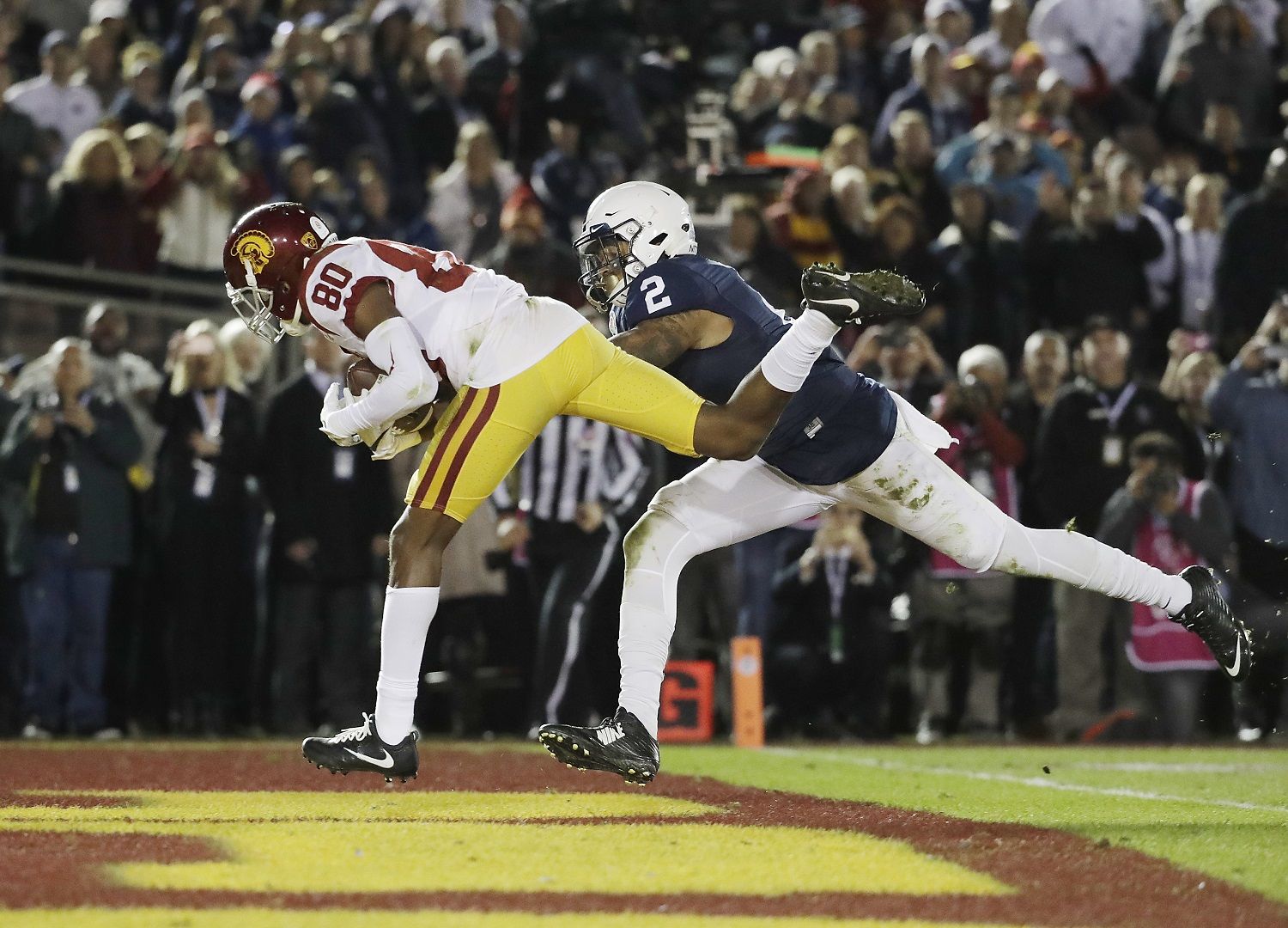 USC Trojans wide receiver Deontay Burnett (80) catches a game-tying touchdown pass over Penn State Nittany Lions safety Marcus Allen (2) during the Rose Bowl NCAA college football game, Monday, Jan. 2, 2017 in Pasadena, Calif. USC defeated Penn State 52-49 on a last second field goal. (AP Photo/Doug Benc)
