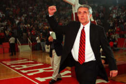 Maryland basketball head coach Gary Williams pumps his fist to the Midnight Madness crowd, Saturday, Oct. 16, 1999, at Cole Field House in College Park, Md. Maryland held it's first practice of the season at midnight.(AP Photo/Nick Wass)