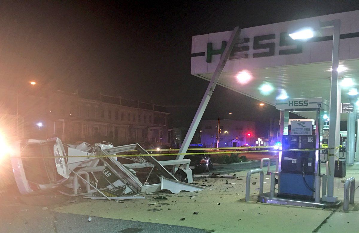 D.C. Fire and EMS said one car crashed into a parked car, then struck part of the structure of the Hess gas station on Florida Avenue NE at around 3:15 a.m.
 (Courtesy DC Fire and EMS)
