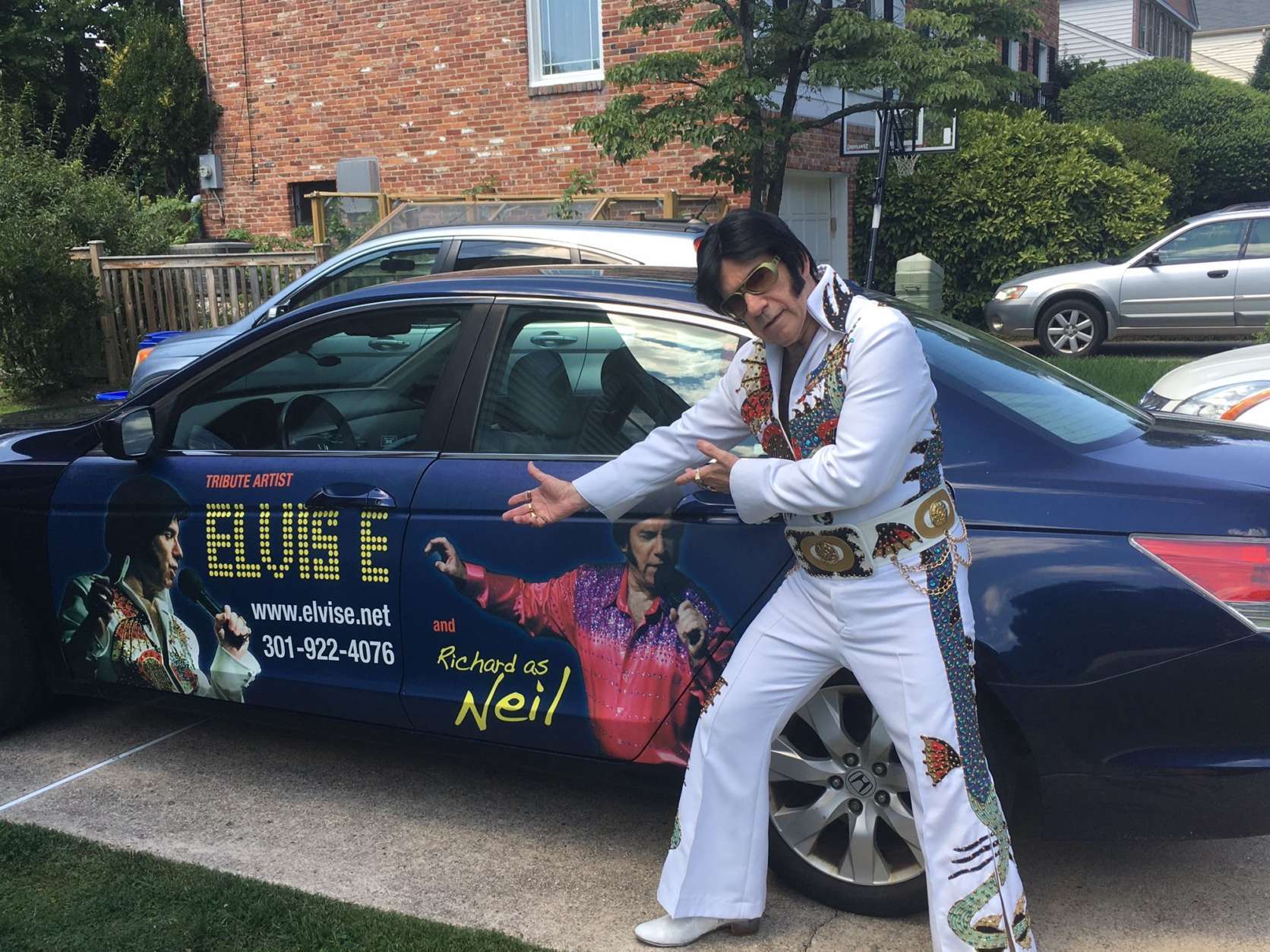 Elvis Presley tribute artist Elvis E with his customized car, in Potomac,. Maryland. (WTOP/Rick Massimo)