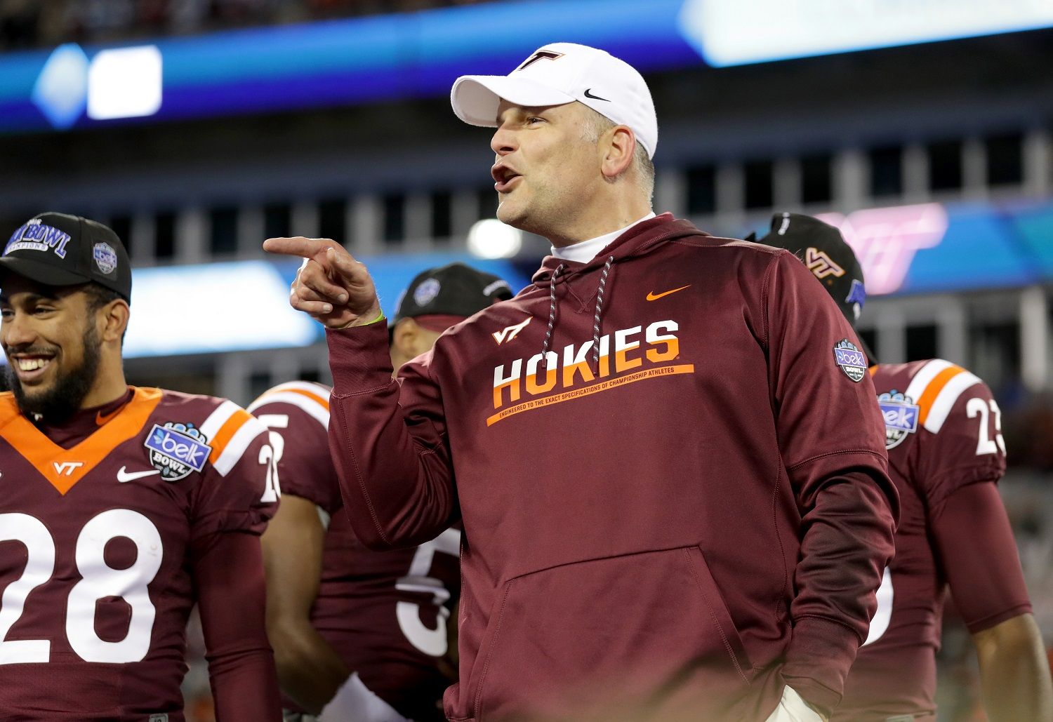 CHARLOTTE, NC - DECEMBER 29:  Head coach Justin Fuente of the Virginia Tech Hokies celebrates after defeating the Arkansas Razorbacks 35-24 in the Belk Bowl at Bank of America Stadium on December 29, 2016 in Charlotte, North Carolina.  (Photo by Streeter Lecka/Getty Images)