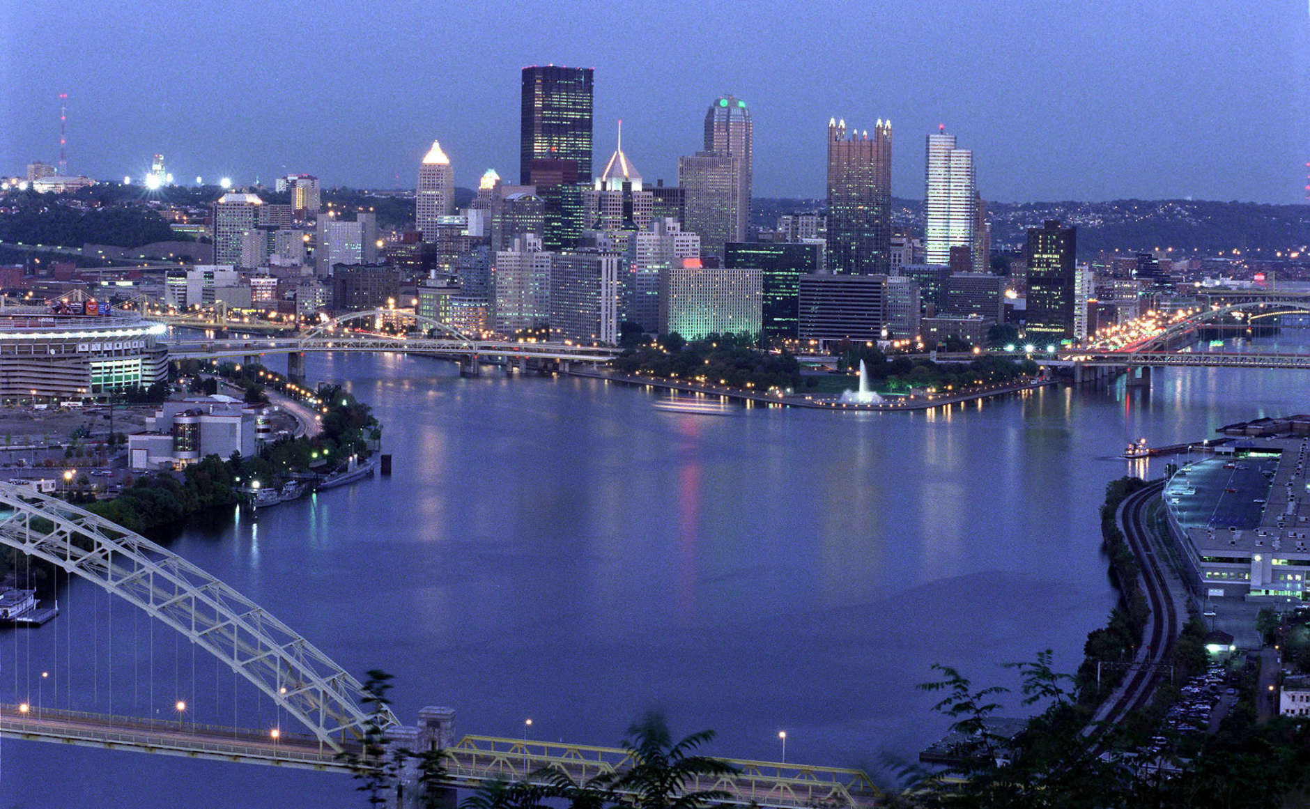 View of the downtown Pittsburgh skyline at dusk,  showing the Allegheny and Monongahela rivers joining to form the Ohio River. Three Rivers Stadium is on the left.  October 7, 1999.  (Photo by Steven Adams/Getty Images)