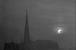 19th June 1936:  The spires of Saint Margaret's Church in Eastcheap, London, during an eclipse of the sun.  (Photo by Harry Todd/Fox Photos/Getty Images)