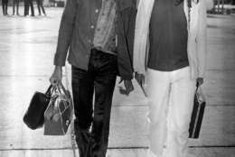 2nd September 1970:  Influential rock guitarist Jimi Hendrix (1942 - 1970) arriving at London Airport with Eric Barrett.  (Photo by Evening Standard/Getty Images)